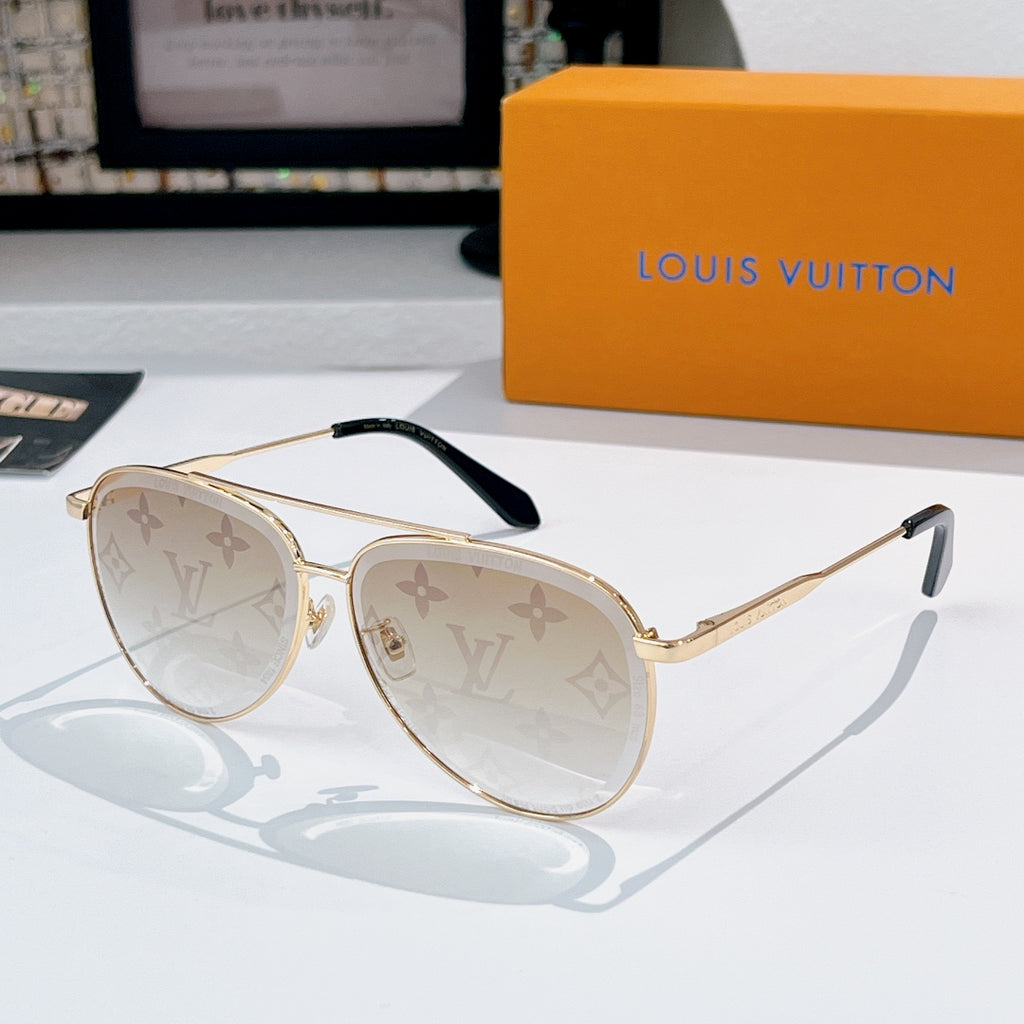 Louis Vuitton sunglasses with gold frame, light tinted lenses, and monogram pattern
