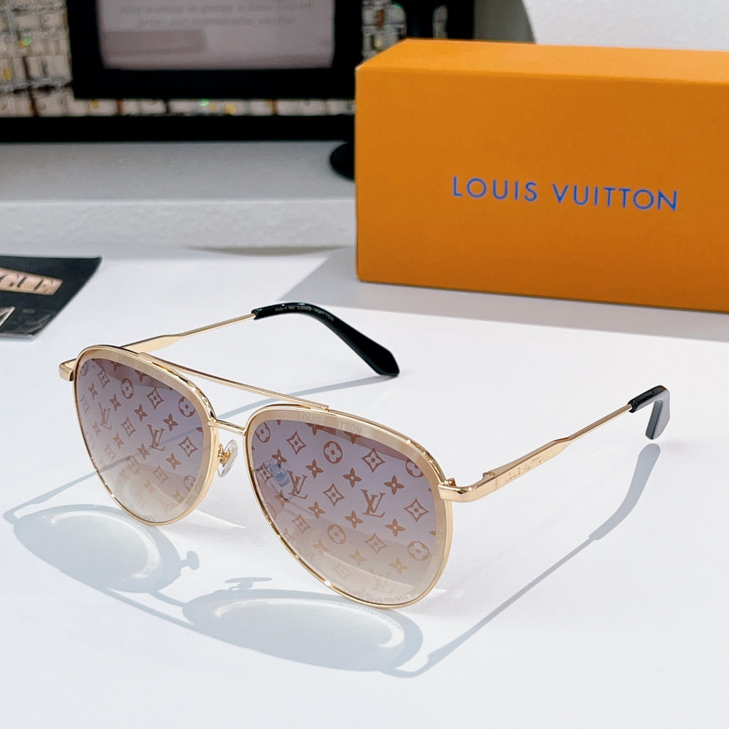 Louis Vuitton sunglasses with gold frame, amber tinted lenses, and monogram pattern