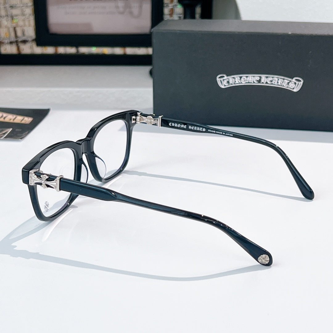 Chrome eyeglasses side view with dark frames and metal bridge detail, clear lenses