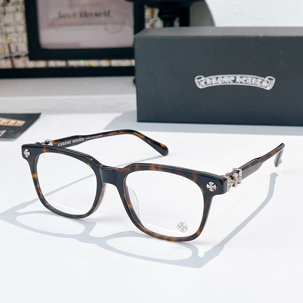Chrome eyeglasses with dark frames and tortoise-pattern temples, clear lenses