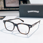 Chrome eyeglasses with dark frames and tortoise-pattern temples, clear lenses