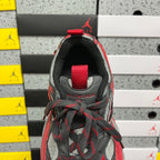 Sneaker tongue and collar showing red strap, black lining, and lace-up bow