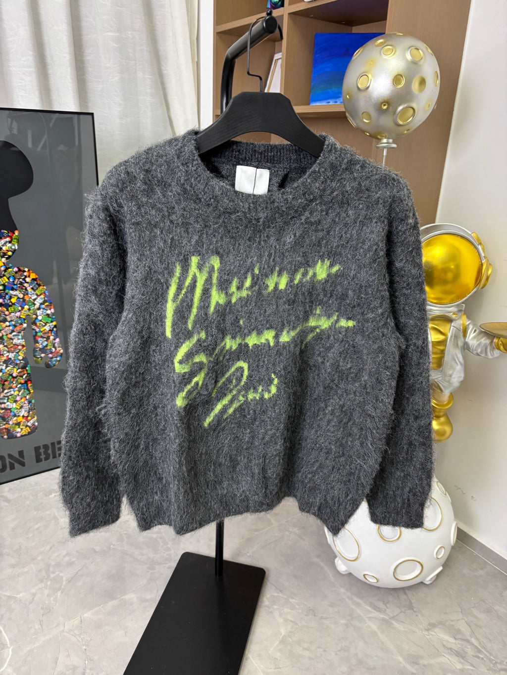 Dark gray fuzzy sweater with neon green graphic print, crew neck, long sleeves