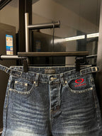 Balenciaga denim shorts front view with waistband, belt loops, and red heart logo patch