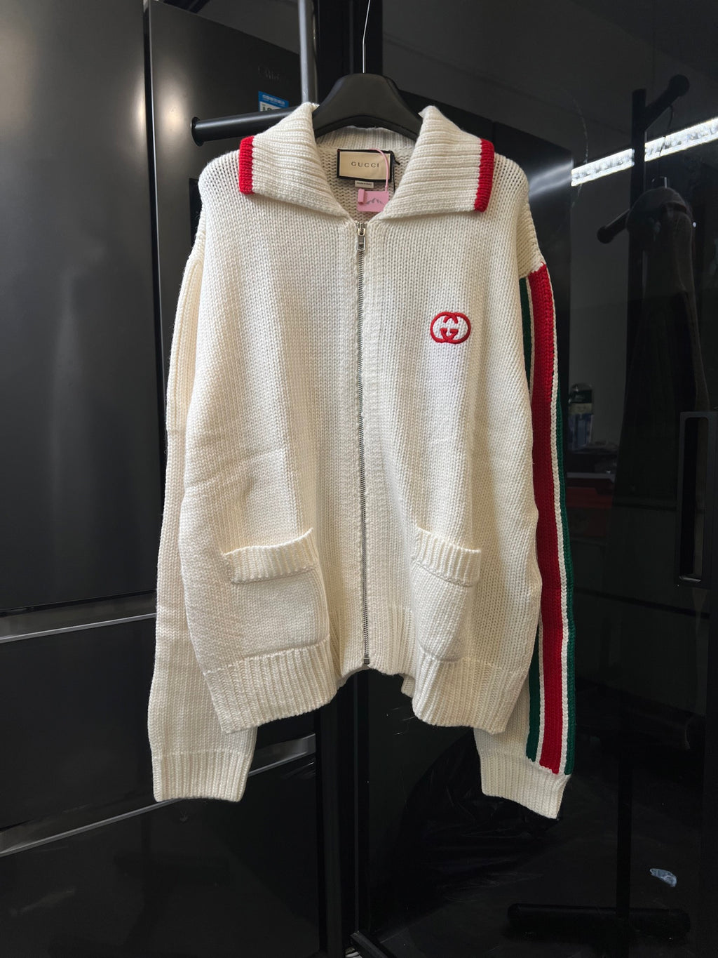 Gucci cream knit zip-up sweater with ribbed collar, red stripe on shoulder, GG patch