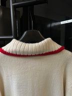 Gucci cream knit sweater back view with ribbed turtleneck and red collar trim