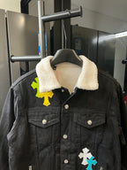 Black denim jacket with sherpa collar, button front, cross patches on chest