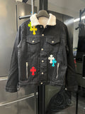 Black denim jacket with sherpa collar and colorful cross patches, button front