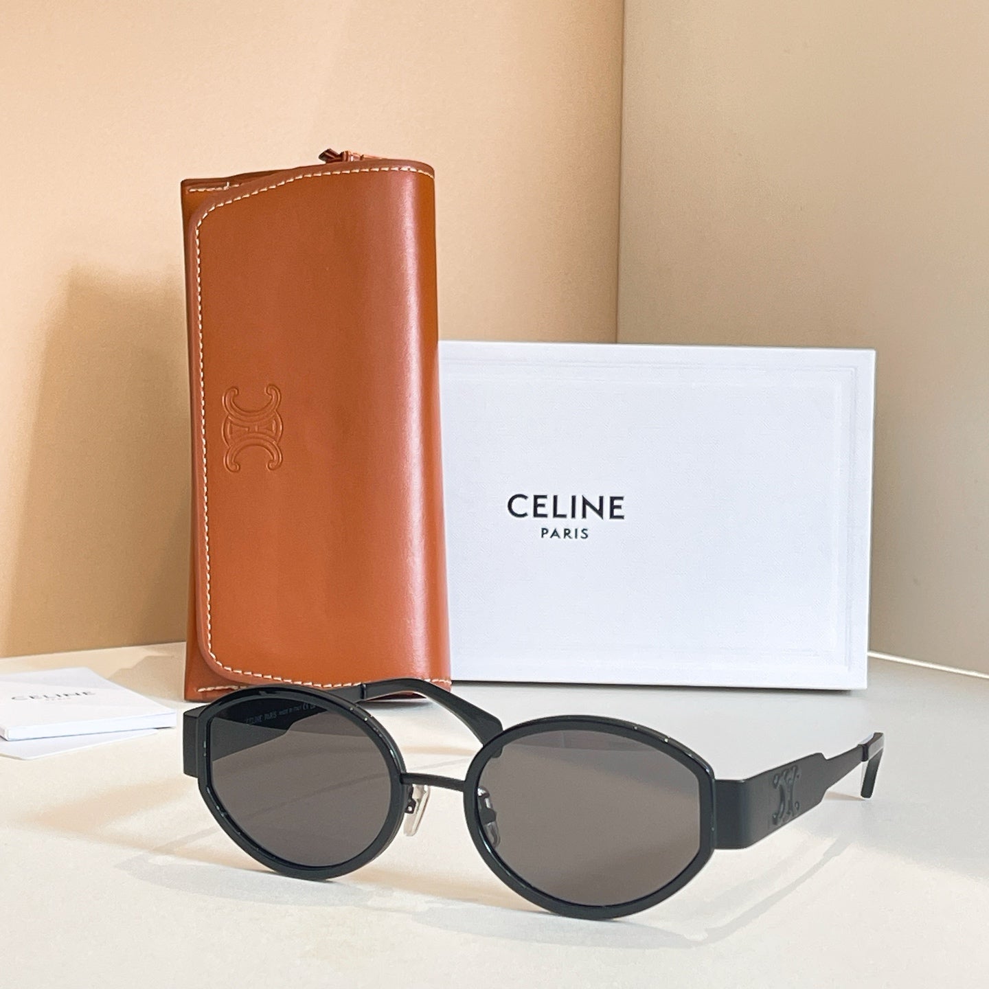 Celine glasses with black round frames and dark tinted lenses