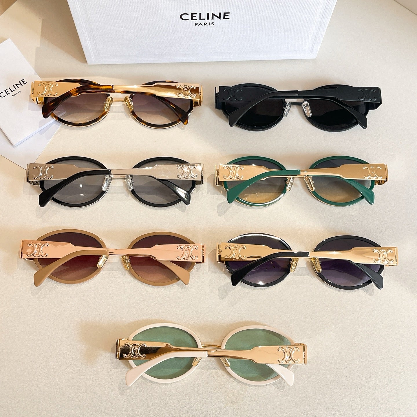 Celine glasses collection on display with mixed frames: brown, black, green, and white