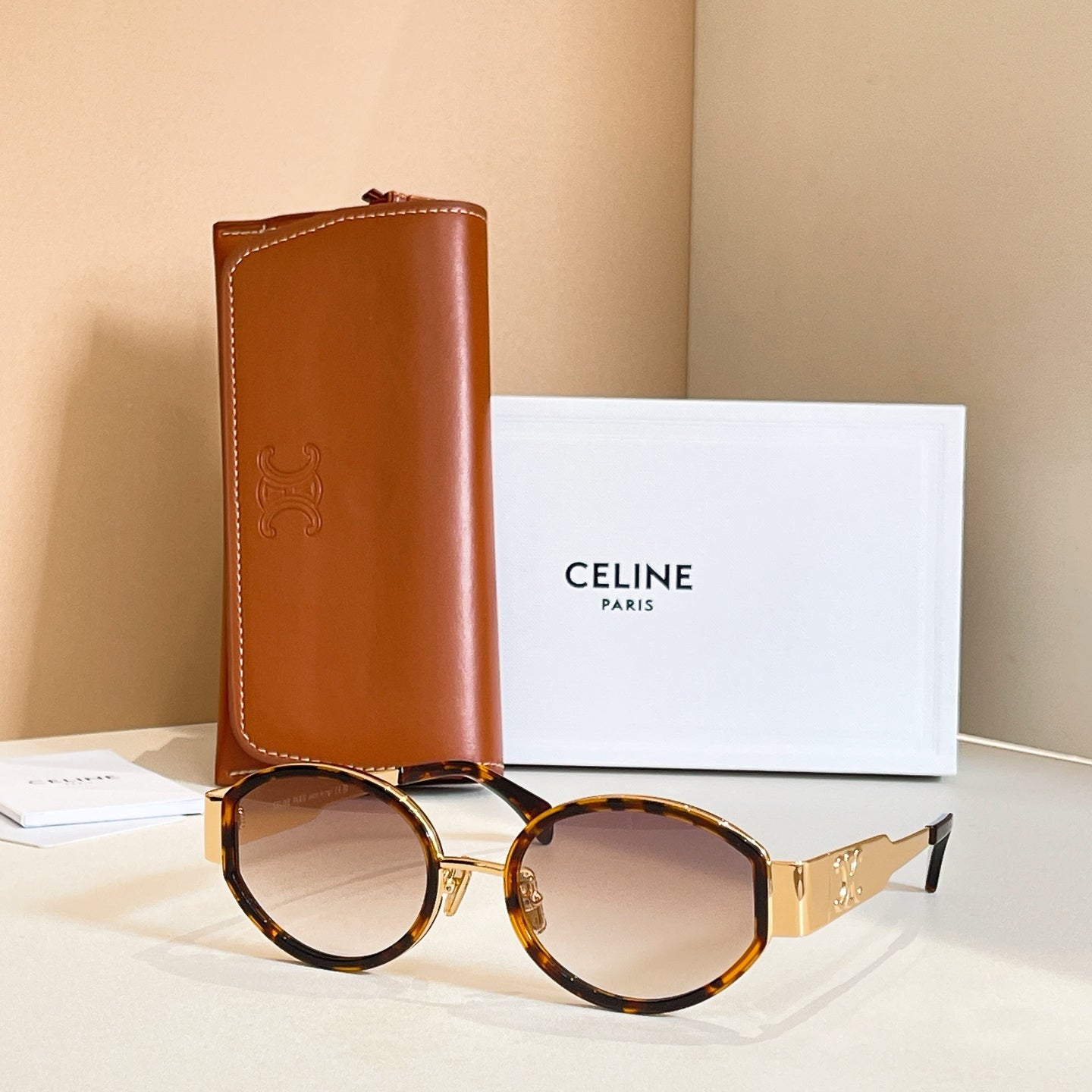 Celine glasses with tortoiseshell round frames and amber tinted lenses