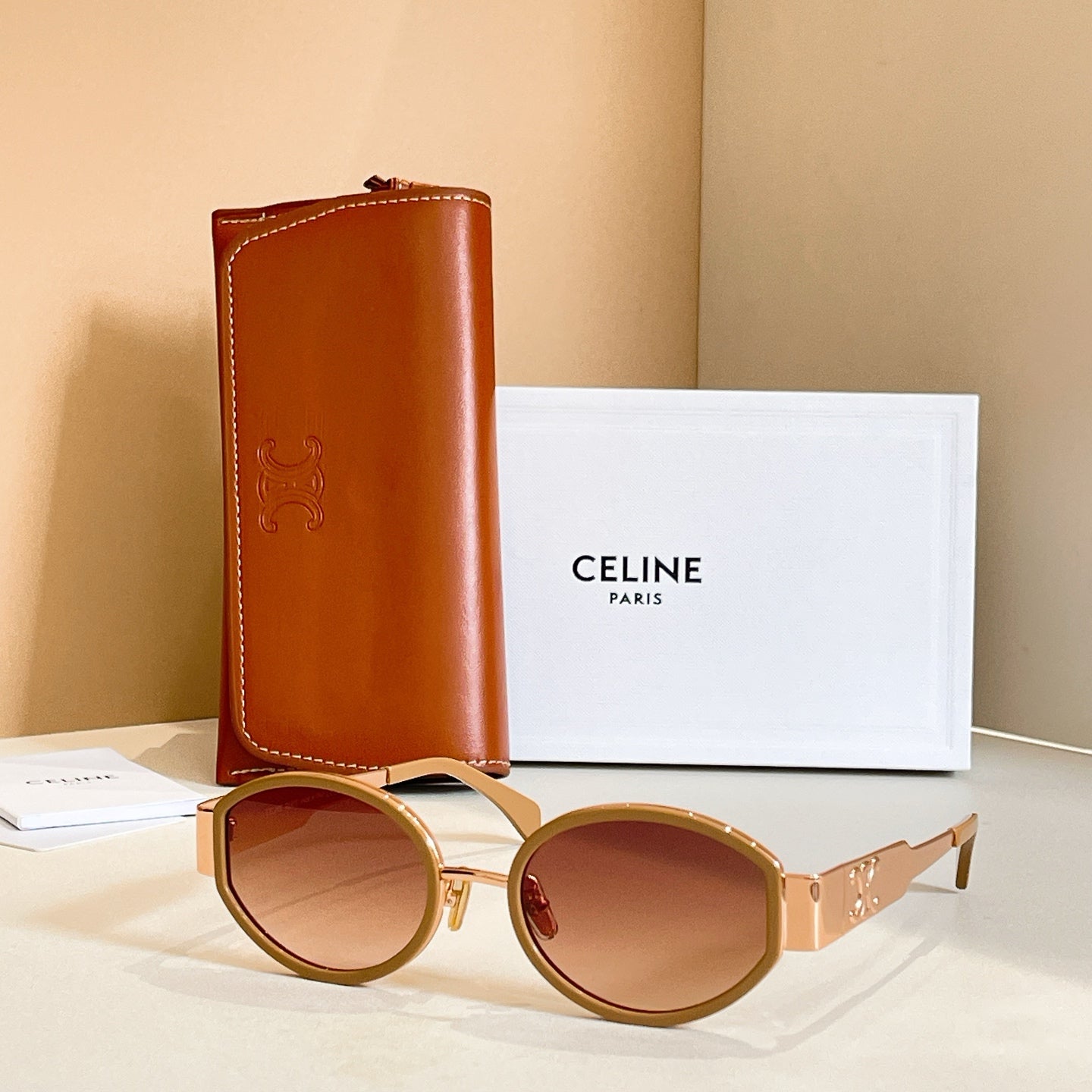 Celine glasses with gold round frames and brown gradient lenses