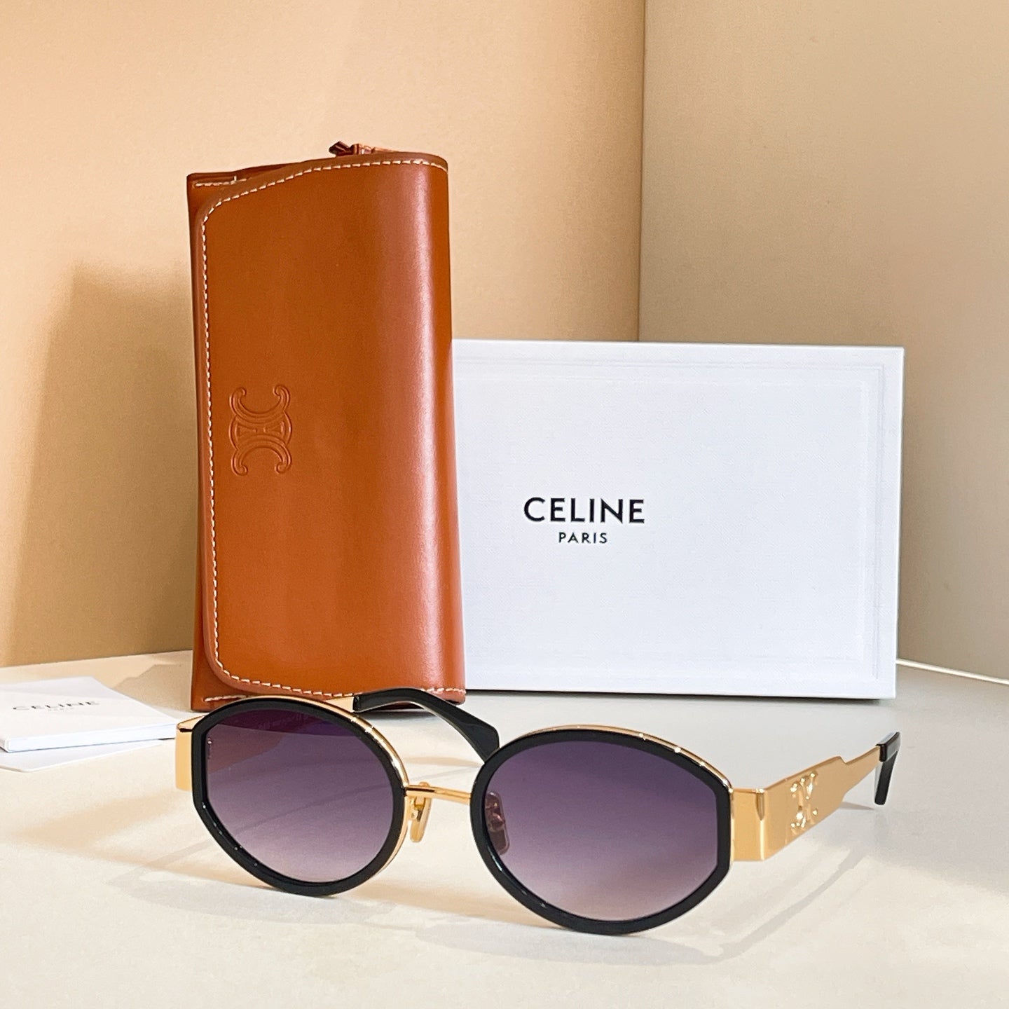 Celine glasses with black frames and purple-tinted lenses