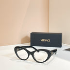 Round eyeglasses with dark frames and clear lenses, black temples with logo details