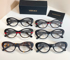 Assorted round eyeglasses with clear lenses in dark and tortoiseshell frames