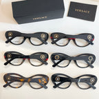Set of round eyeglasses with clear lenses in dark, tortoiseshell, and red-accented frames