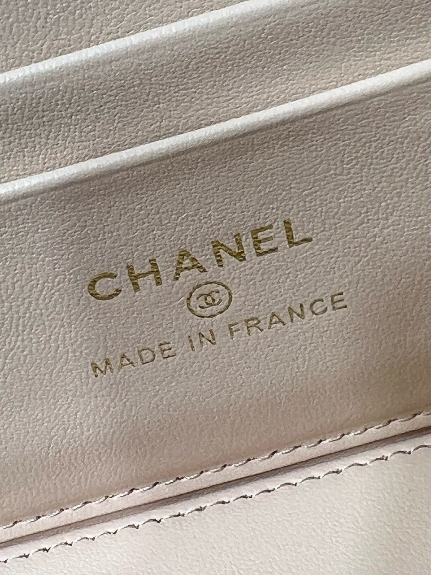 Chanel logo and "Made in France" on light beige leather inner label.