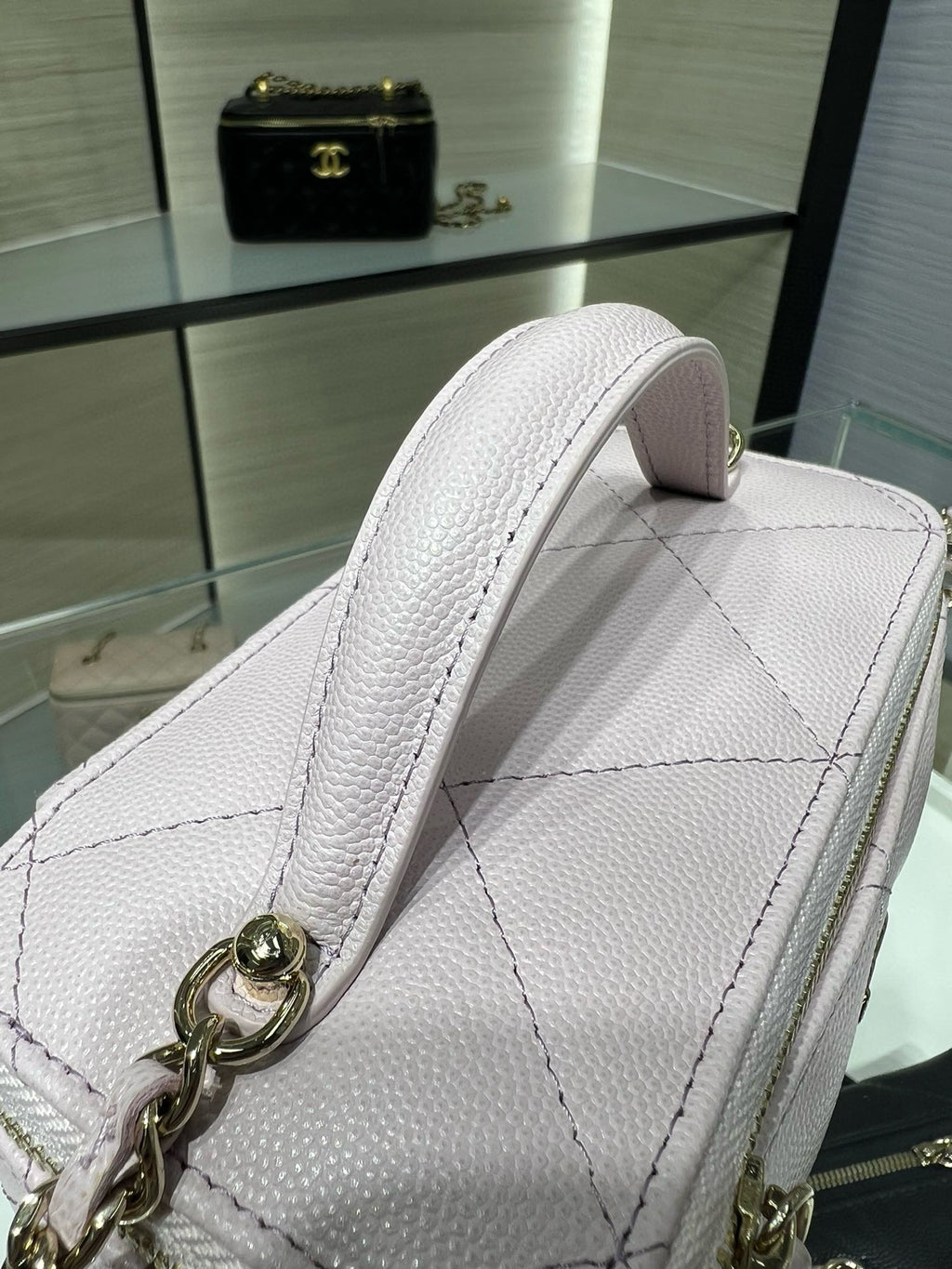 Chanel light pink textured leather mini bag with chain strap and gold zipper pull