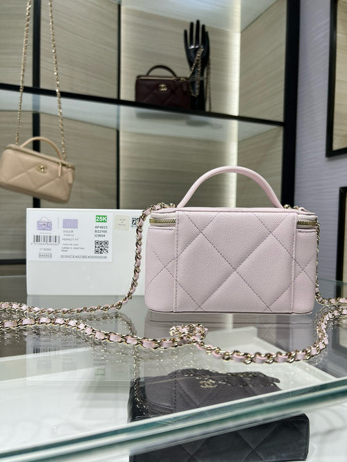 Chanel mini bag in light pink quilted leather with top handle and chain strap