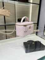 Chanel mini bag in light pink quilted leather with short handle and chain strap