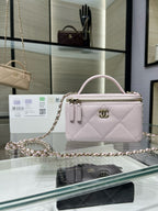Chanel mini bag in light pink quilted leather with chain strap and zip top