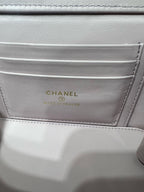 Chanel interior label in light pink bag reading CHANEL, MADE IN FRANCE