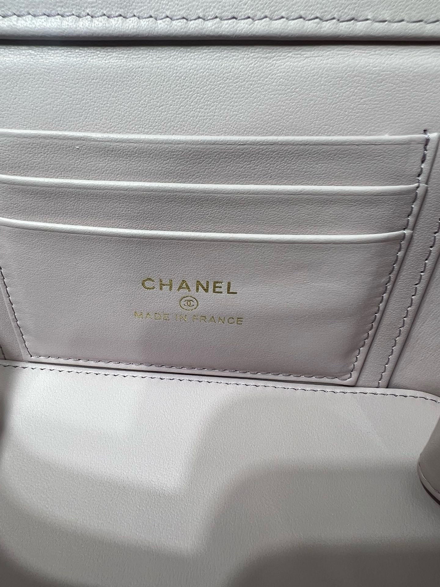 Chanel interior label in light pink bag reading CHANEL, MADE IN FRANCE