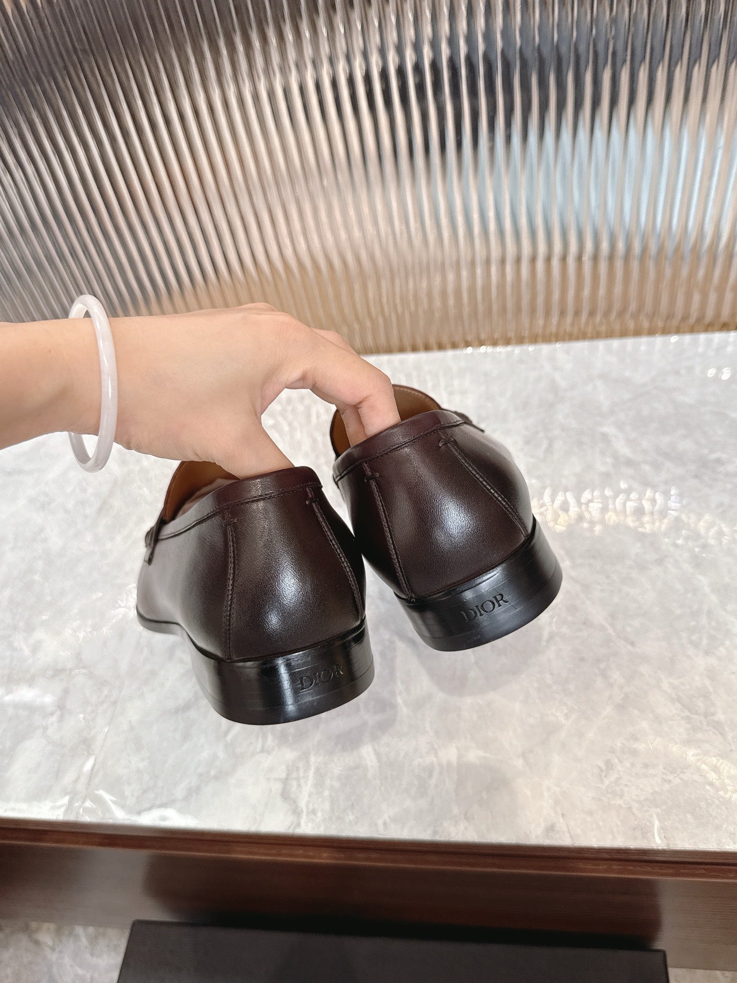 Burgundy leather loafer backs, low heel and cushioned lining visible