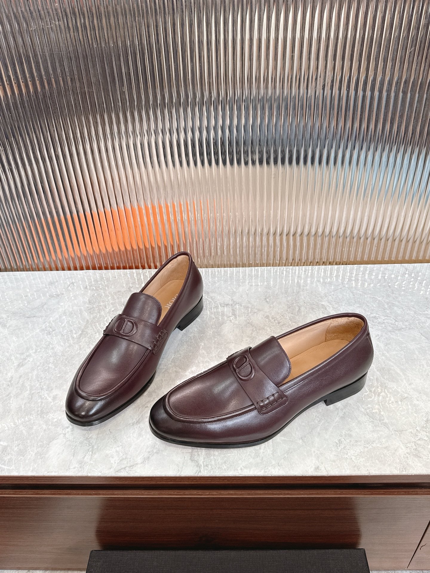 Burgundy leather loafer pair, showing front and side with DD strap