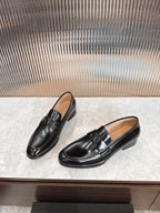 Dior unisex black leather loafers, side view with buckle strap detail