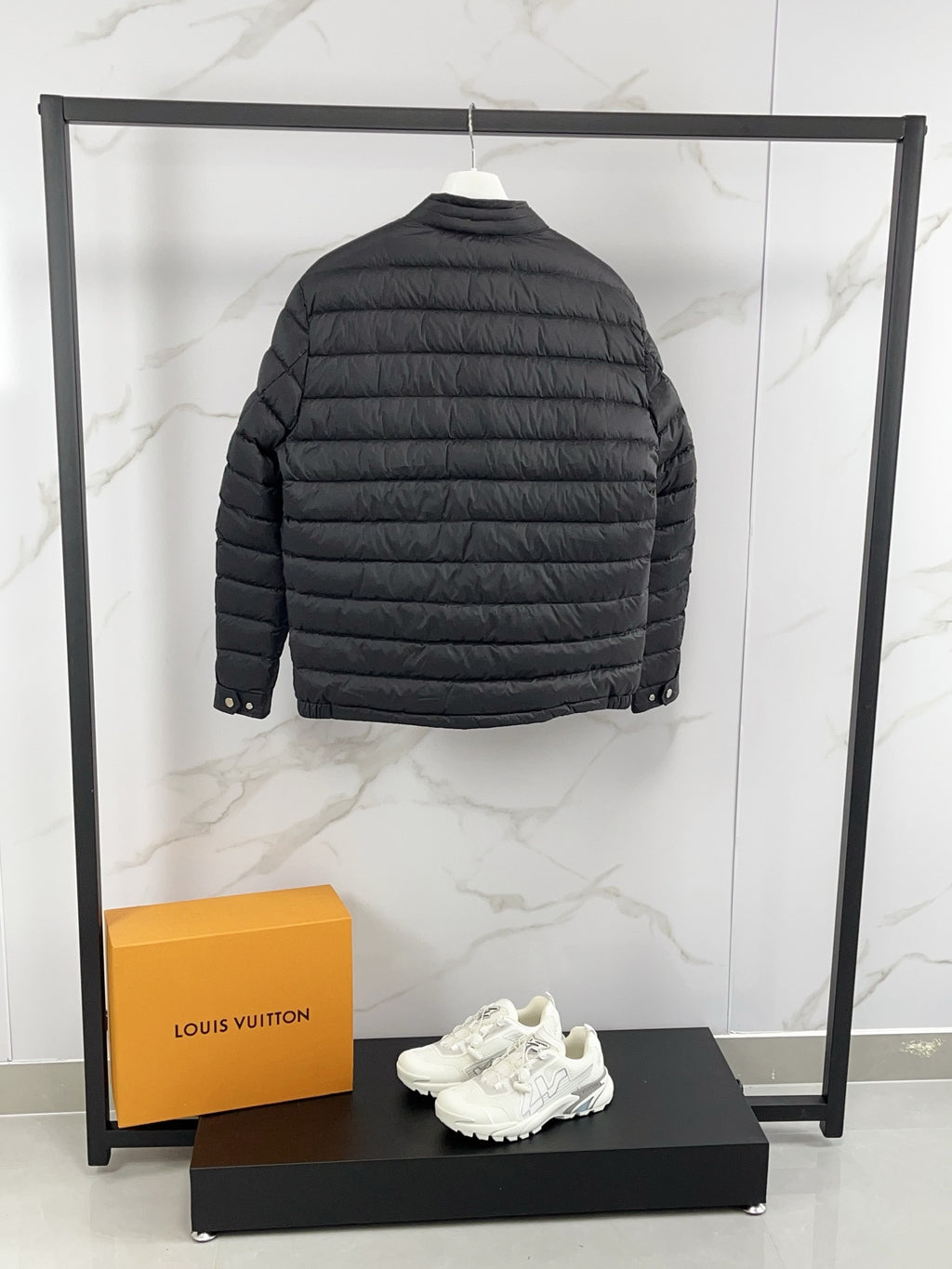 Moncler long padded jacket, dark gray quilted back with full sleeves.