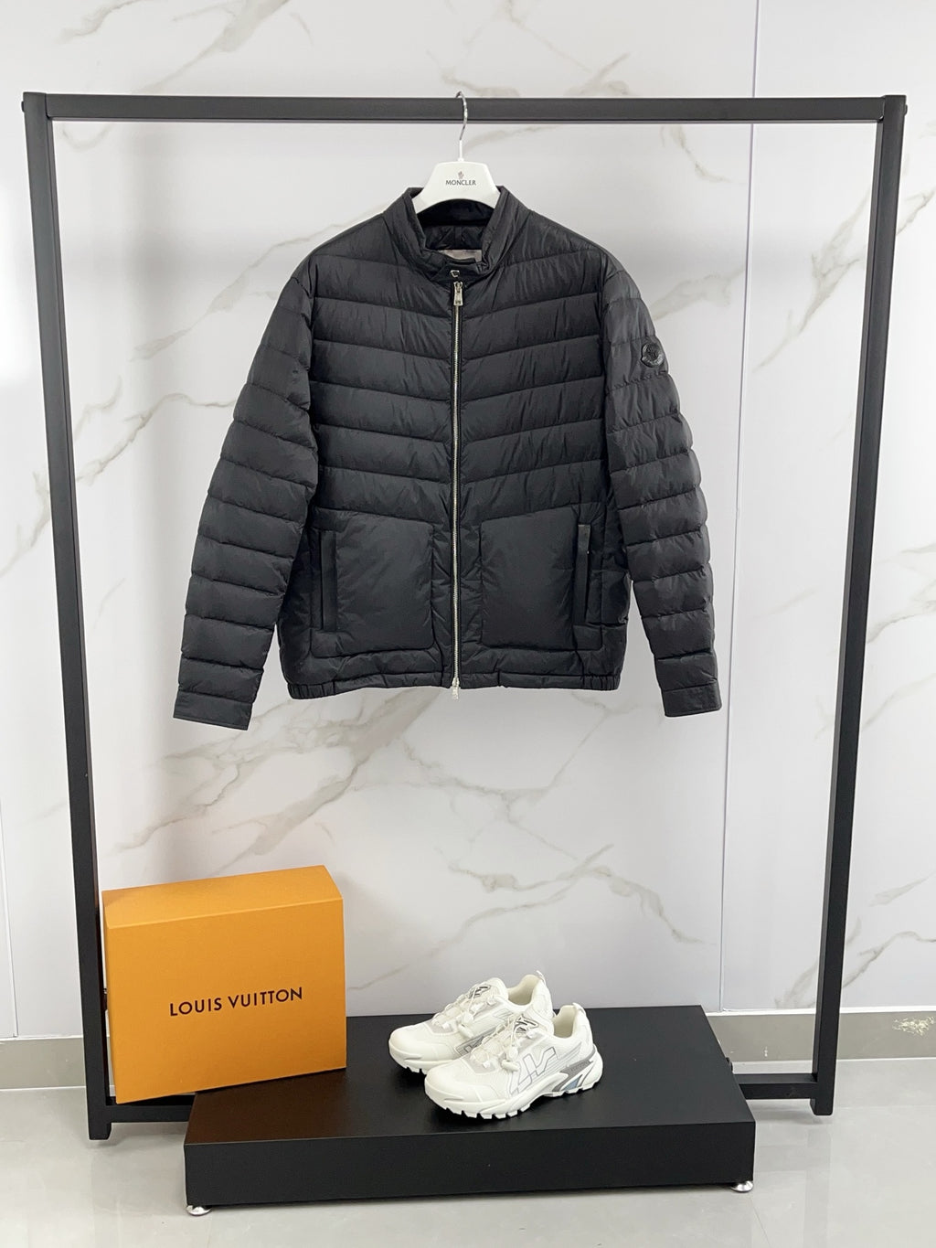 Moncler long padded jacket, dark gray with full zip and stand collar.