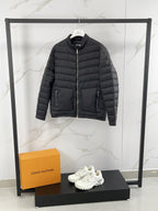 Moncler long padded jacket, dark gray quilted puffer with two side pockets.