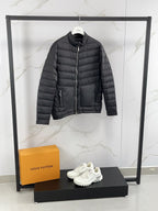 Moncler long padded jacket, dark gray quilted puffer with side zip pockets.
