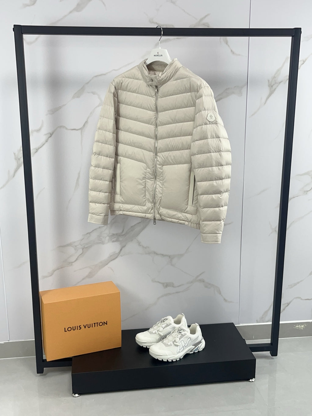 Moncler light beige quilted puffer jacket, front view with stand collar