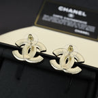 Chanel CC logo cufflink-style earrings in gold-tone finish on black fabric