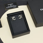 Pearl and gold-tone chain earrings set displayed in black jewelry box