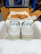 White Louis Vuitton trainer sneakers with #52 heel tabs and lace-up front, pair view