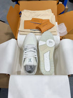 White Louis Vuitton trainer sneakers with outsole view and lace-up fronts, in open box