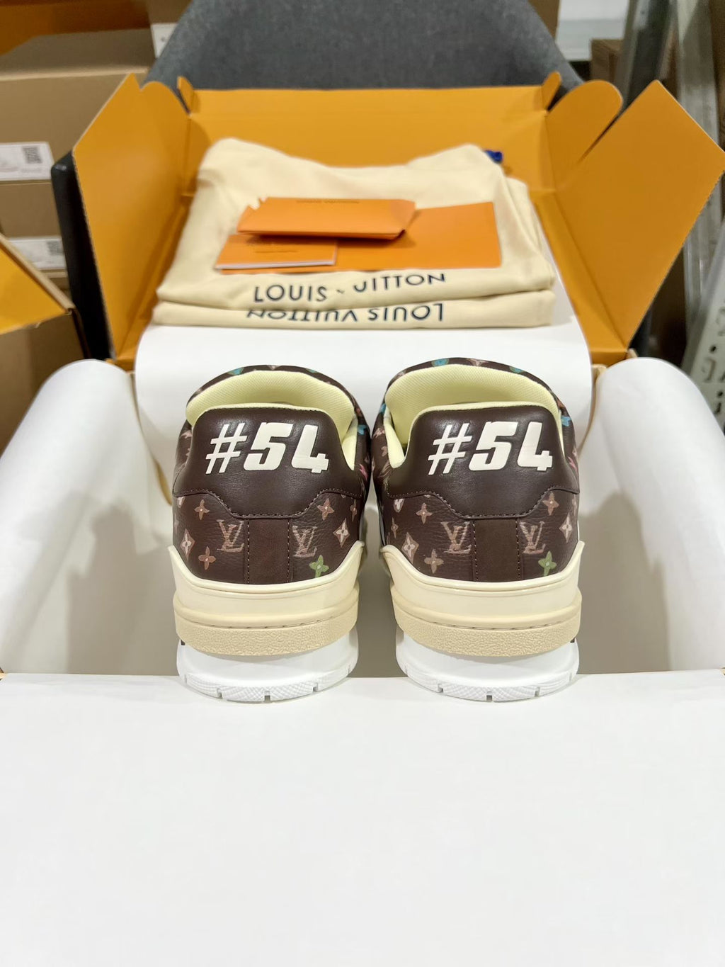 Louis Vuitton trainer shoes in dark brown monogram with #54 on back soles
