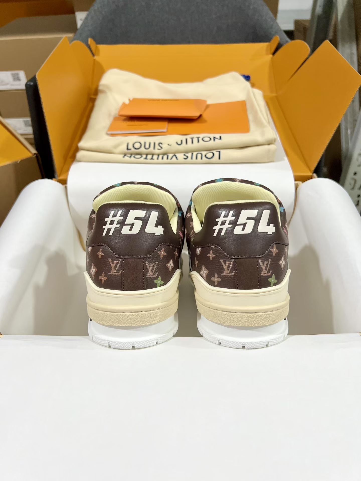 Louis Vuitton trainer shoes in dark brown monogram with #54 on back soles