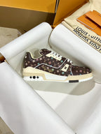 Louis Vuitton trainer shoe in dark brown monogram with white laces and cream heel