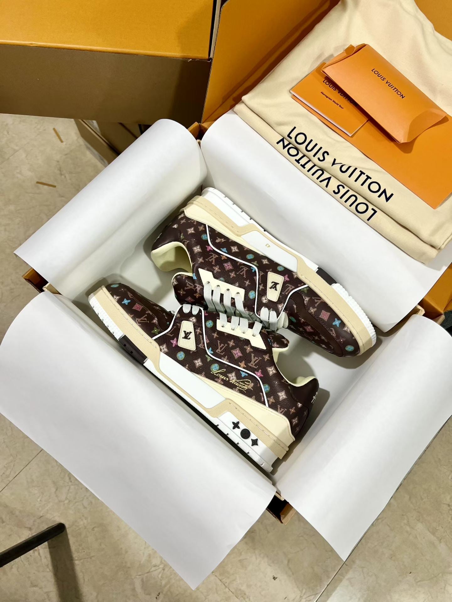 Louis Vuitton trainer shoes in dark brown monogram with white laces and platform sole
