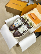 Louis Vuitton trainer shoes in dark brown monogram with white laces and cream sole