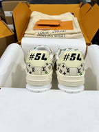 Louis Vuitton sneakers with white monogram print and “#54” text on the heel backs