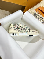 Louis Vuitton trainer sneakers in white with multicolor monogram pattern, side profile