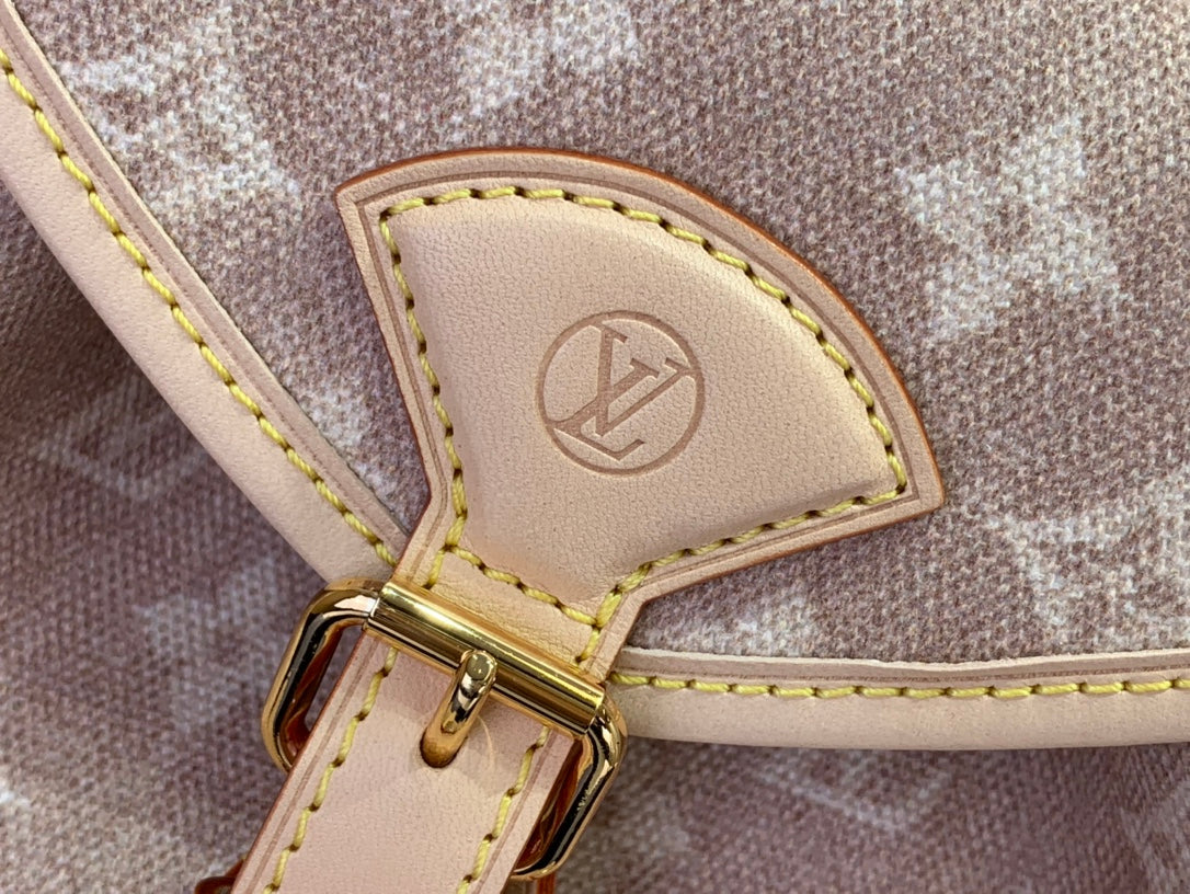 Louis Vuitton leather logo patch on monogram strap with gold buckle and yellow stitching