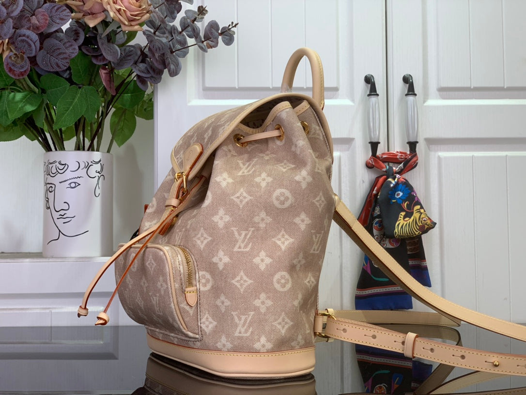 Louis Vuitton monogram backpack shown at angle with shoulder strap and drawstring closure