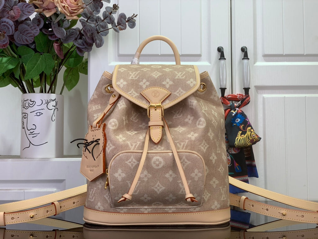 Louis Vuitton monogram backpack with drawstring top, tan leather trim, and top handle