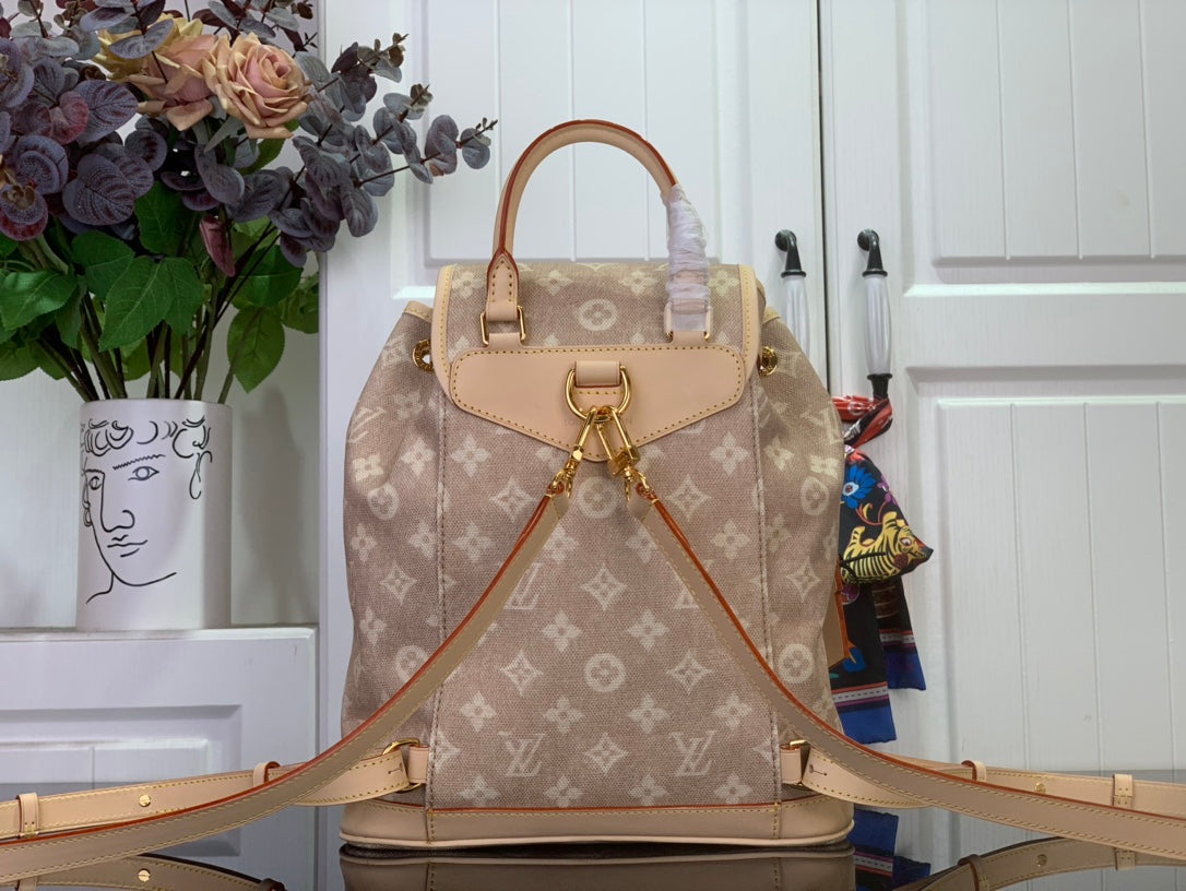 Louis Vuitton monogram backpack front view with top handle, front strap, and drawstring